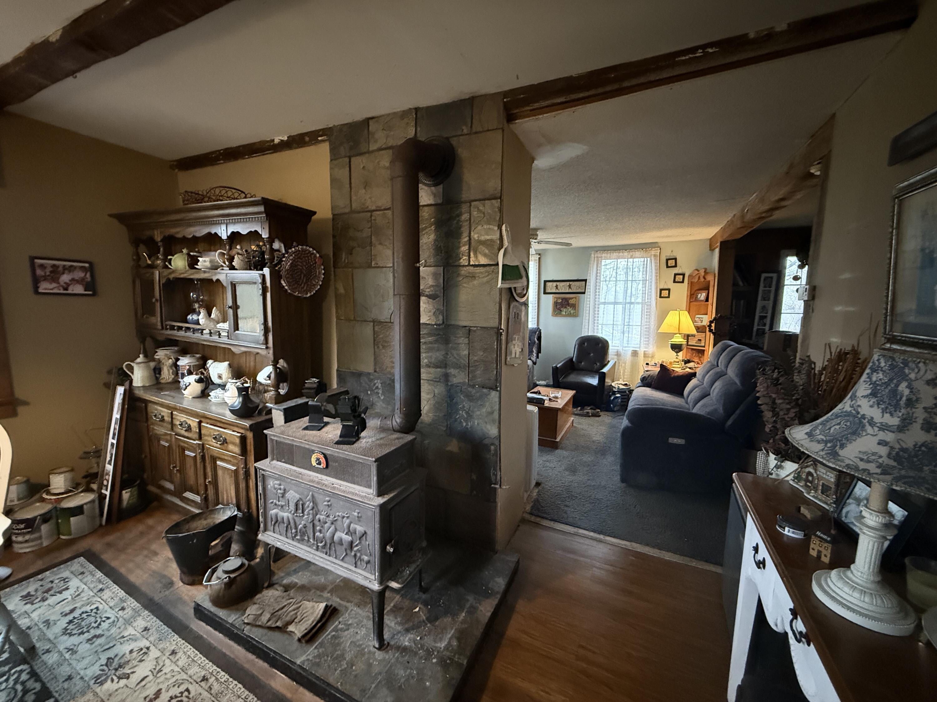 75 Nelson Ridge Road South Washington, ME 04574 - Photo 6 of 27 Wood Stove in Dining Room