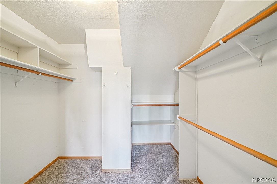 25274 N Road Twin Peaks, CA 92391 - Photo 19 of 41 a view of walk in closet with empty racks