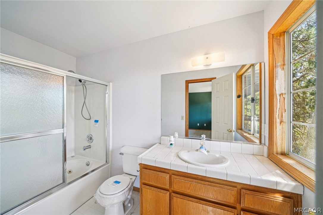 25274 N Road Twin Peaks, CA 92391 - Photo 20 of 41 a bathroom with a sink toilet and shower