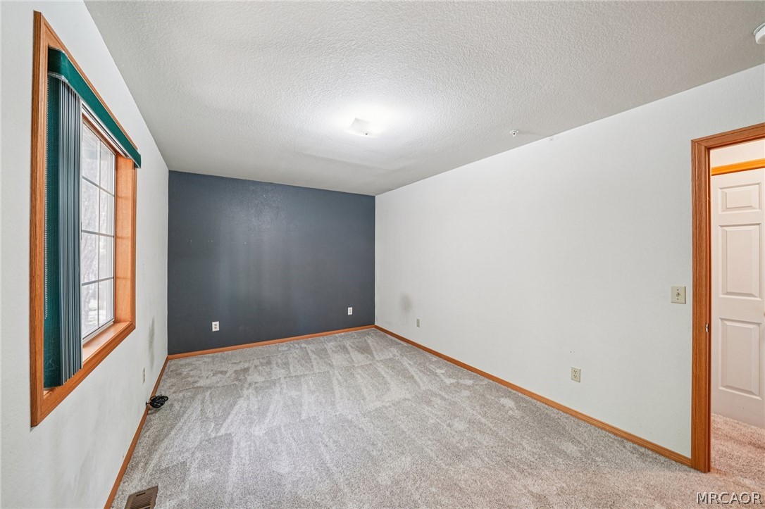 25274 N Road Twin Peaks, CA 92391 - Photo 22 of 41 a view of an empty room with a window