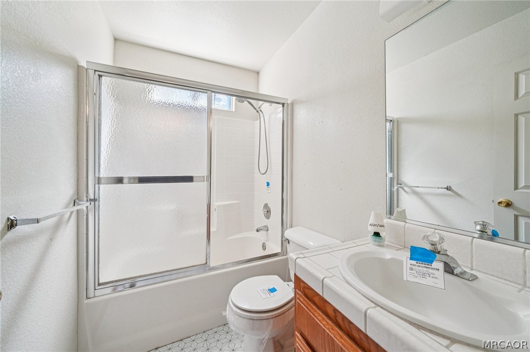 25274 N Road Twin Peaks, CA 92391 - Photo 24 of 41 a bathroom with a sink toilet and shower
