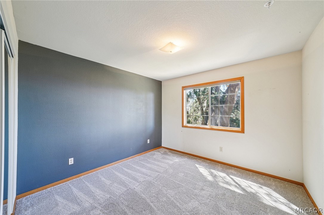 25274 N Road Twin Peaks, CA 92391 - Photo 25 of 41 a view of an empty room with a window