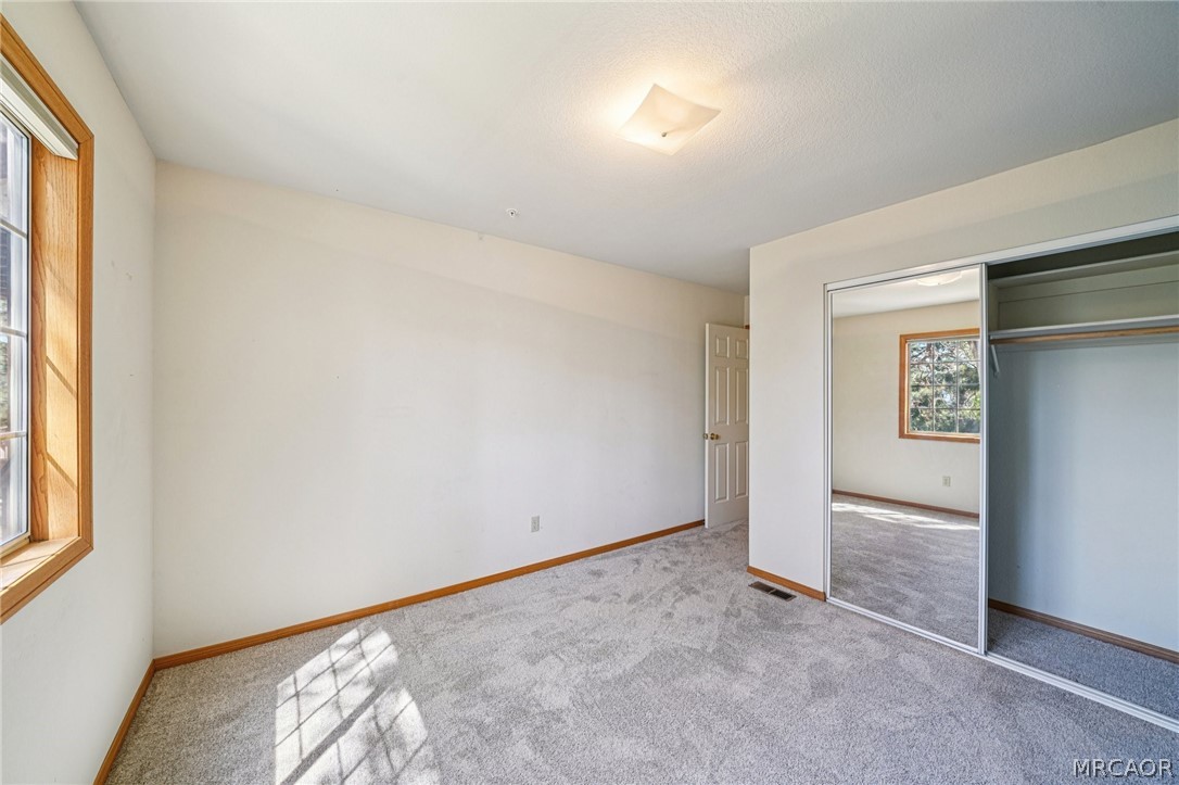 25274 N Road Twin Peaks, CA 92391 - Photo 26 of 41 an empty room with windows