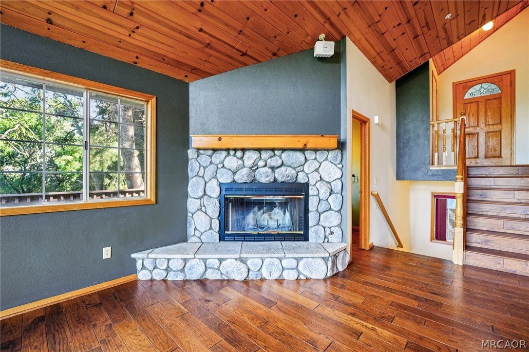 25274 N Road Twin Peaks, CA 92391 - Photo 3 of 41 a living room with a fireplace and next to a window