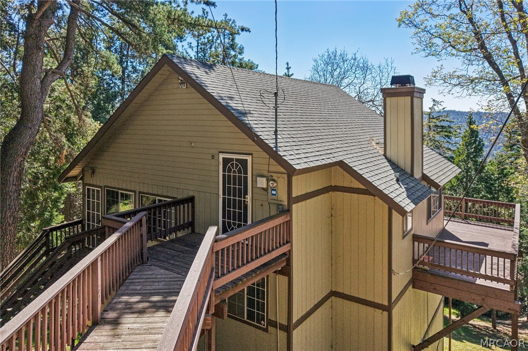 25274 N Road Twin Peaks, CA 92391 - Photo 33 of 41 a view of a house with wooden fence and floor