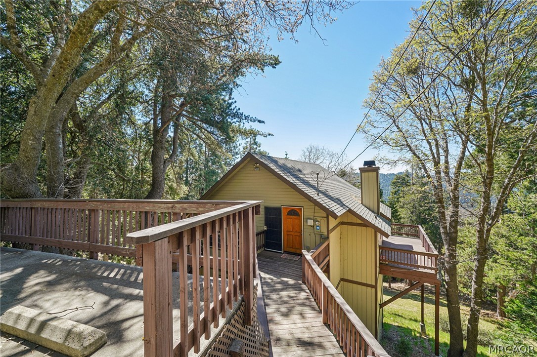 25274 N Road Twin Peaks, CA 92391 - Photo 34 of 41 a view of a wooden deck and trees in the house