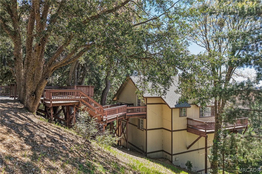 25274 N Road Twin Peaks, CA 92391 - Photo 35 of 41 a backyard of a house with table and chairs