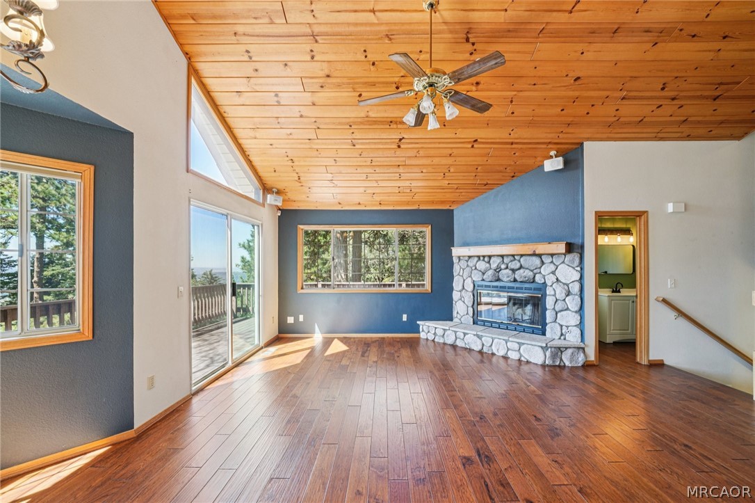 25274 N Road Twin Peaks, CA 92391 - Photo 4 of 41 a view of empty room with wooden floor and fireplace