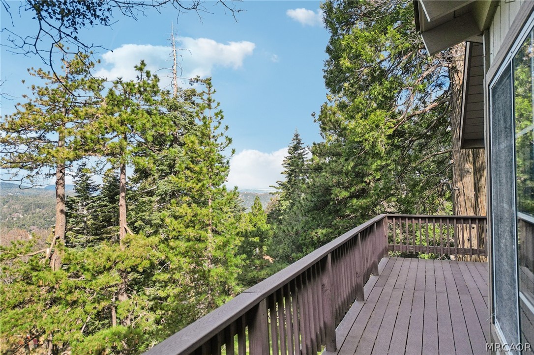25274 N Road Twin Peaks, CA 92391 - Photo 7 of 41 a balcony with trees in front of it