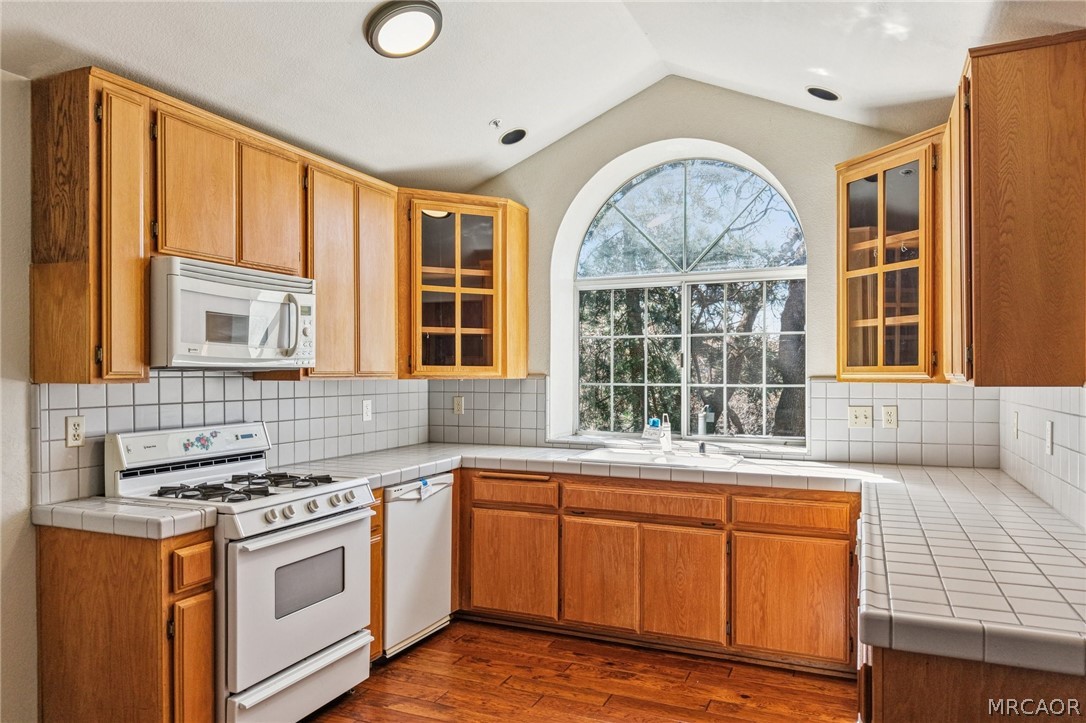 25274 N Road Twin Peaks, CA 92391 - Photo 8 of 41 a view of a kitchen counter top space and wooden floor