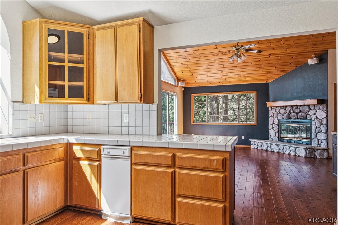 25274 N Road Twin Peaks, CA 92391 - Photo 9 of 41 a kitchen with stainless steel appliances granite countertop a stove a sink and a microwave
