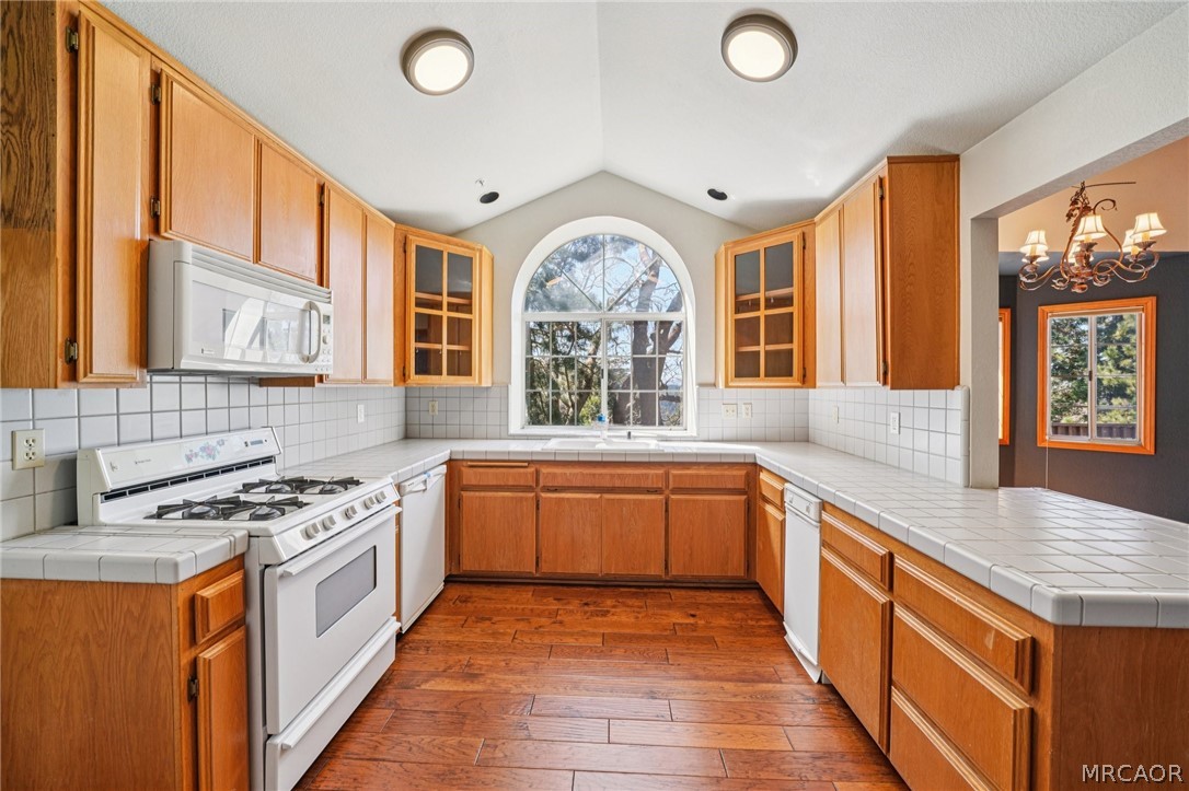 25274 N Road Twin Peaks, CA 92391 - Photo 10 of 41 a kitchen with stainless steel appliances granite countertop a stove a sink and a refrigerator