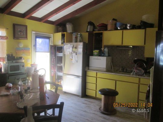 2021 South Inyo Street Ridgecrest, CA 93555 - Photo 3 of 7 a dining room with furniture and wooden floor
