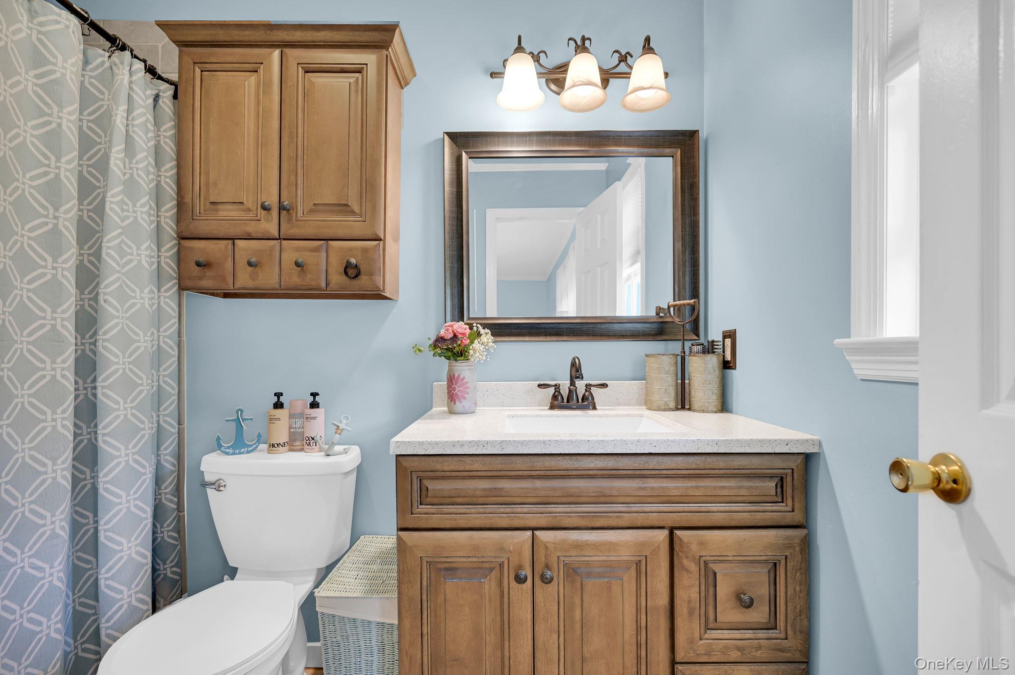 28 Brady Road Warwick, NY 10990 - Photo 27 of 50 a bathroom with a sink vanity mirror and toilet