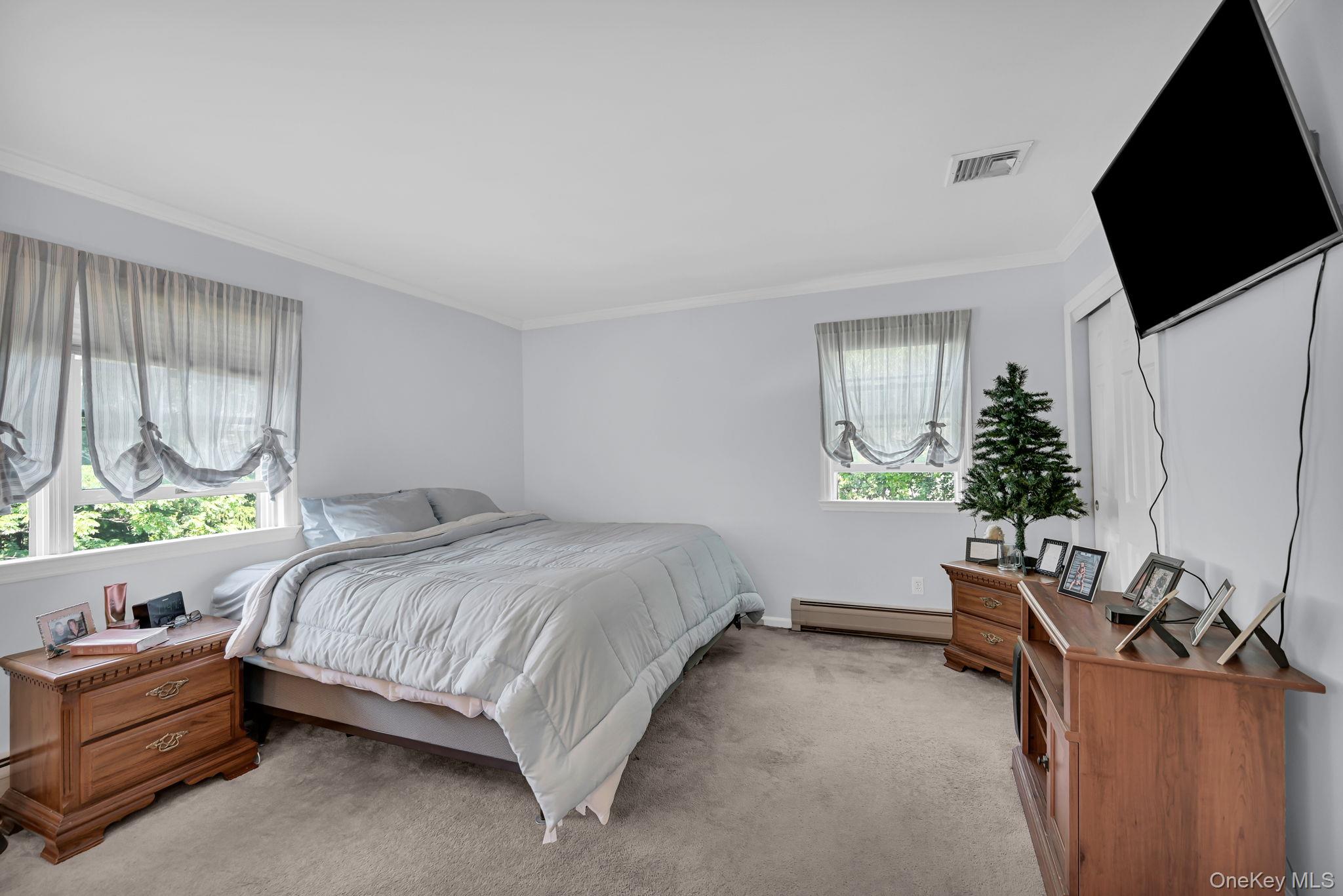 28 Brady Road Warwick, NY 10990 - Photo 28 of 50 a bedroom with a bed window table and television