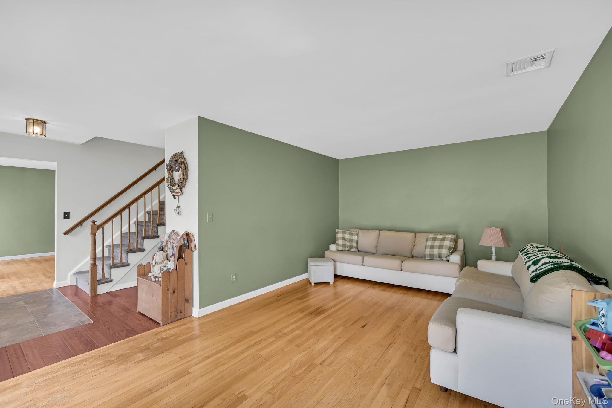 28 Brady Road Warwick, NY 10990 - Photo 7 of 50 a living room with furniture and stairs
