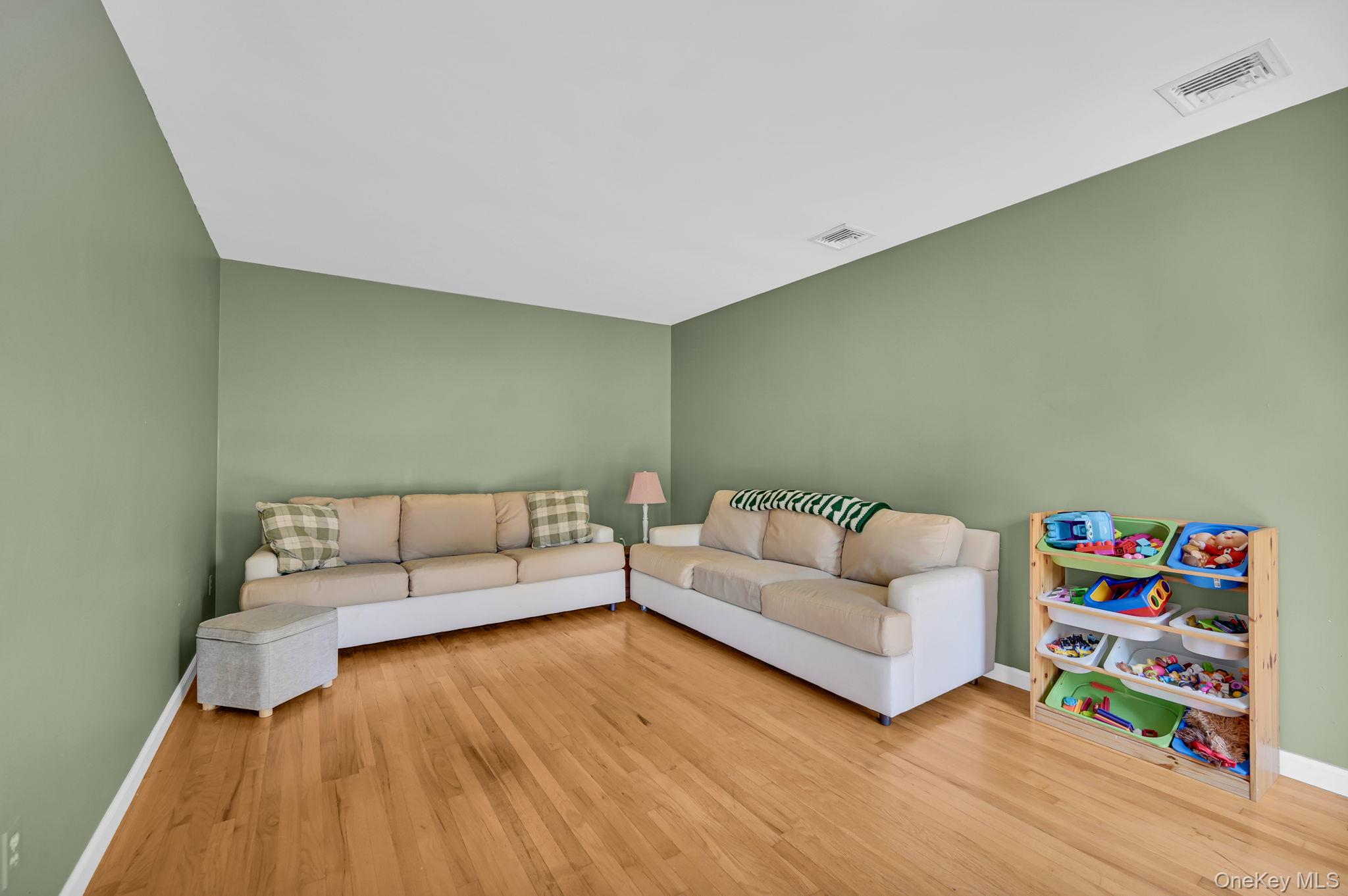 28 Brady Road Warwick, NY 10990 - Photo 8 of 50 a living room with furniture and a wooden floor