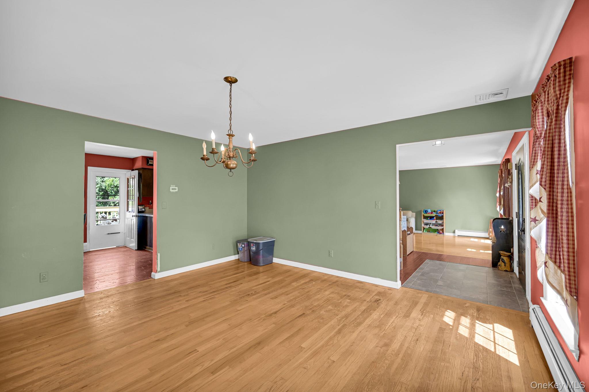 28 Brady Road Warwick, NY 10990 - Photo 9 of 50 a bedroom with a bed and a chandelier