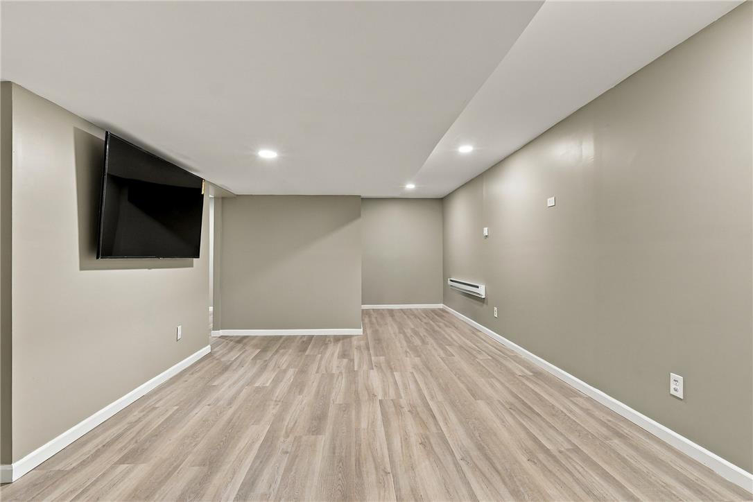 1657 Rachel Road Stroudsburg, PA 18360 - Photo 35 of 46 Smooth wood-look flooring and clean drywall finishes define this versatile lower level living area.