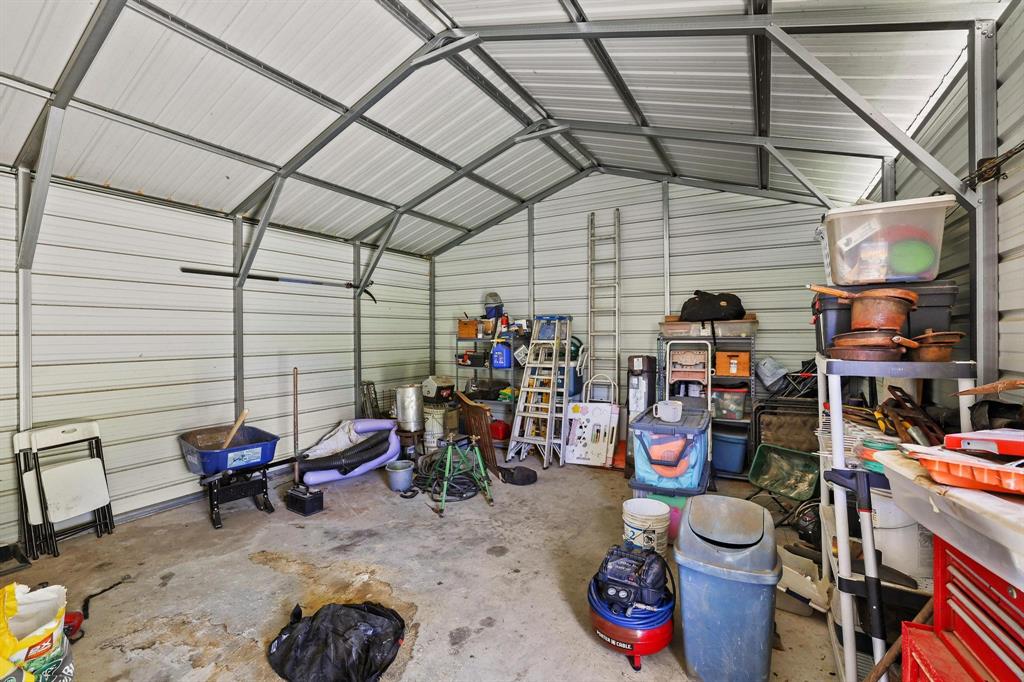 2658 Oak Ridge Road Denison, TX 75021 - Photo 30 of 37 a view of a storage room with lots of stuff