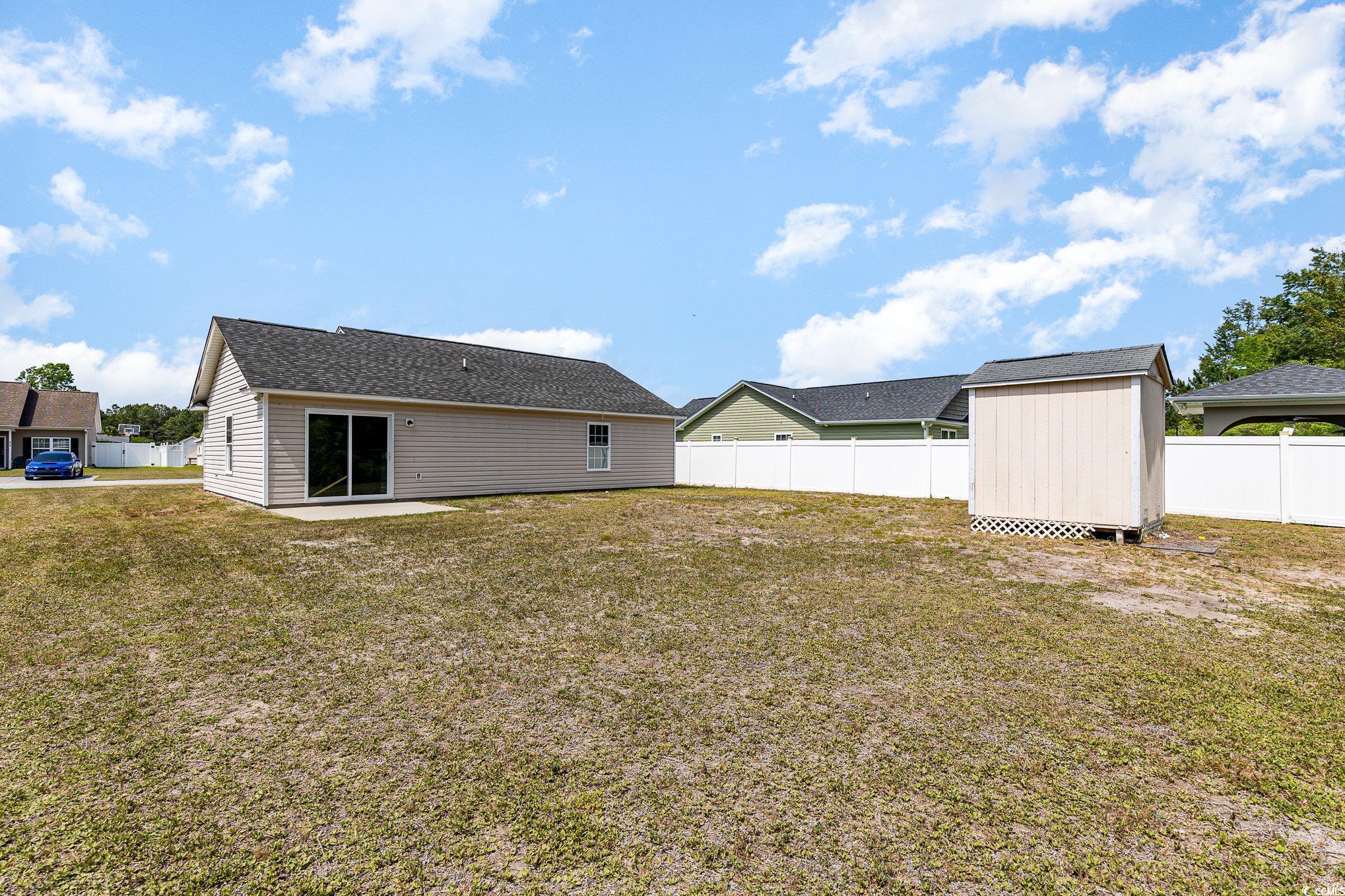 469 Overcrest Street Myrtle Beach, SC 29579 - Photo 18 of 18 Rear view of property with a storage shed, a lawn,
