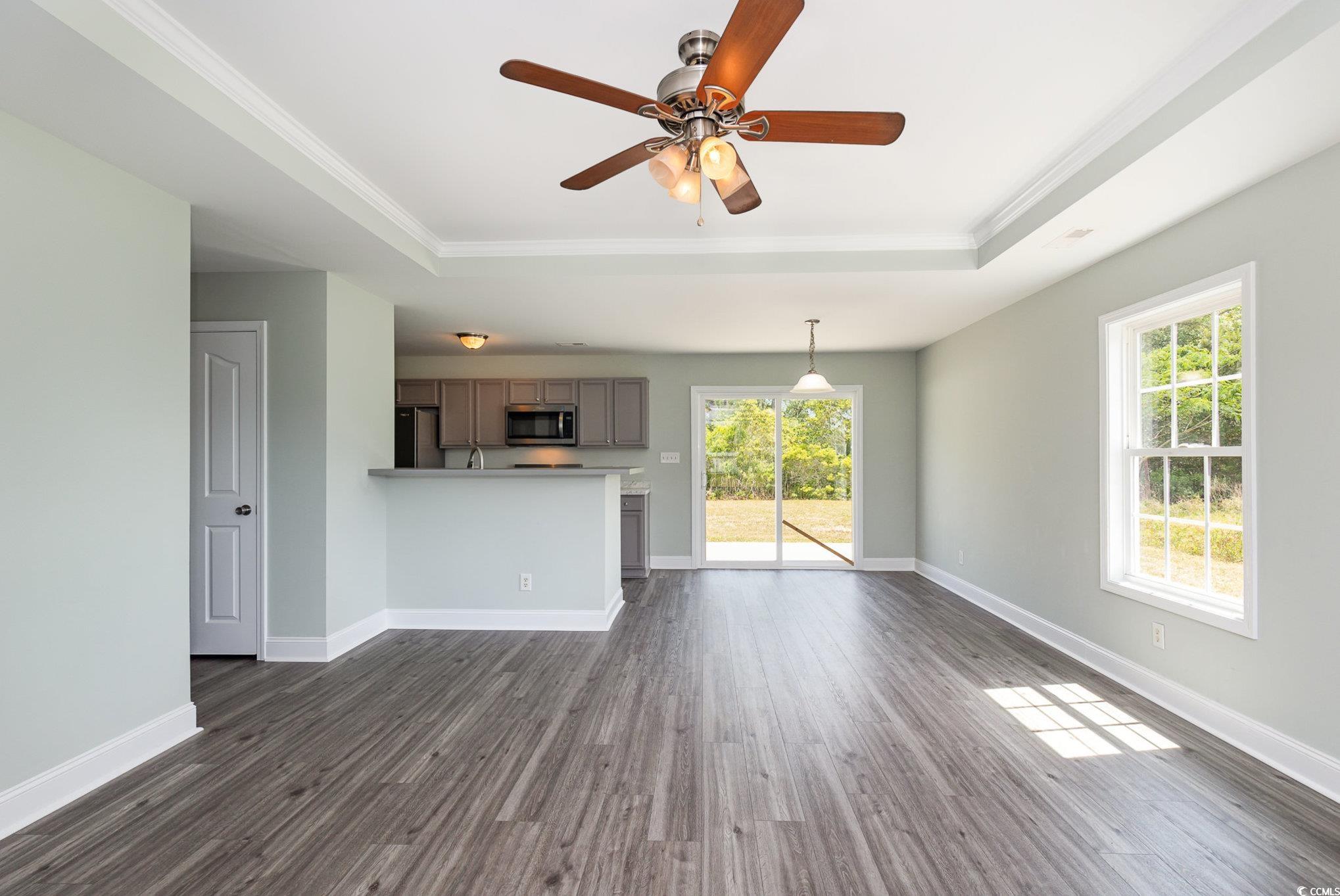 469 Overcrest Street Myrtle Beach, SC 29579 - Photo 4 of 18 Unfurnished living room with a raised ceiling, orn