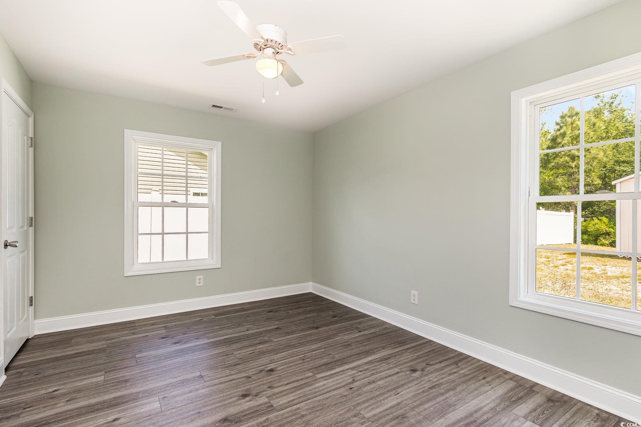 469 Overcrest Street Myrtle Beach, SC 29579 - Photo 7 of 18 Unfurnished bedroom featuring dark wood-style floo