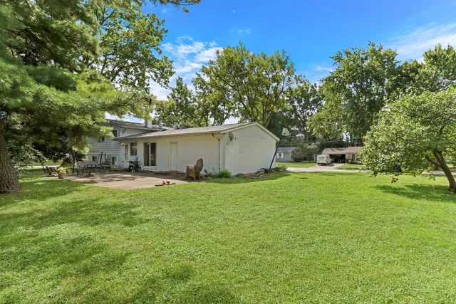 a front view of house with yard and seating area