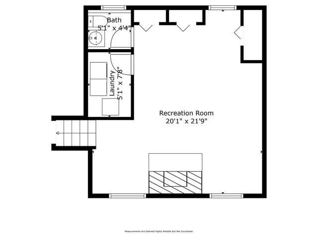 a picture of a bench in front of a wall