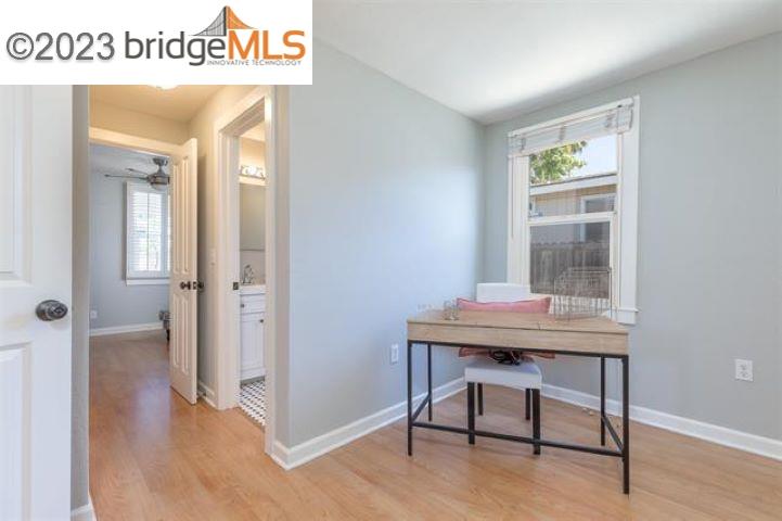 2734 D Street Antioch, CA 94509 - Photo 5 of 15 a view of a workspace with furniture and wooden floor