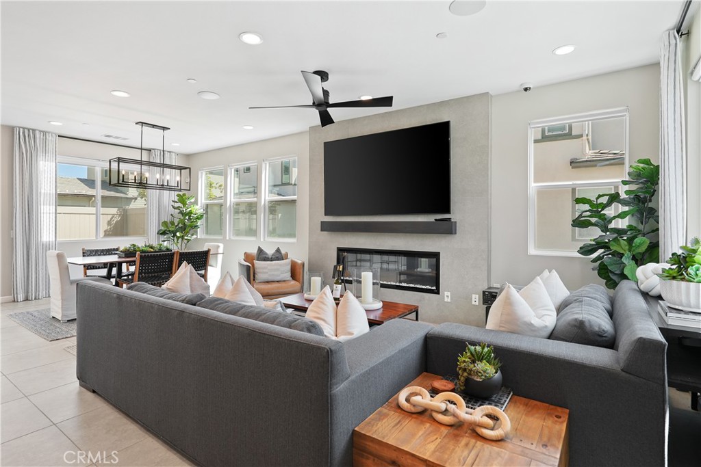 32522 Brunello Way Temecula, CA 92591 - Photo 11 of 75 a living room with fireplace furniture and a flat screen tv