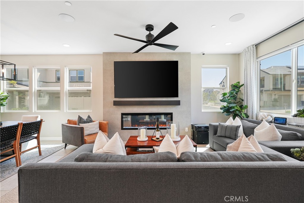 32522 Brunello Way Temecula, CA 92591 - Photo 12 of 75 a living room with furniture and a flat screen tv