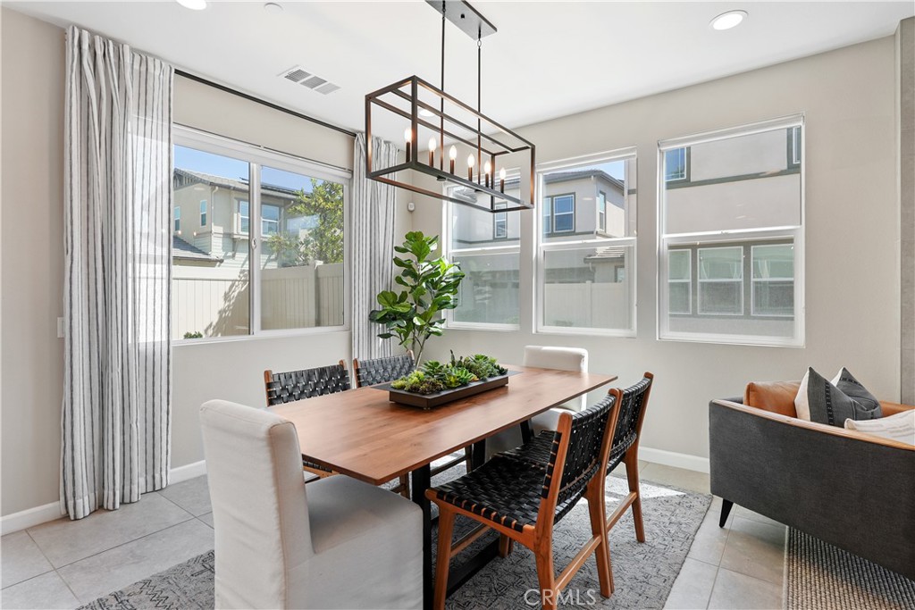 32522 Brunello Way Temecula, CA 92591 - Photo 15 of 75 a view of a dining room with furniture window and outside view