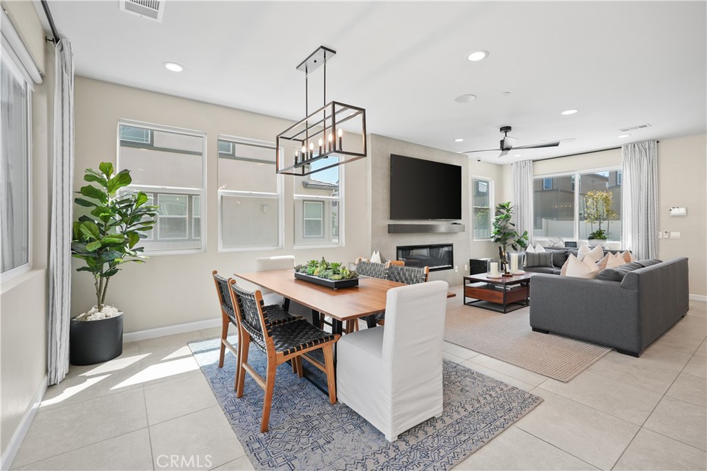 32522 Brunello Way Temecula, CA 92591 - Photo 17 of 75 a living room with furniture potted plant and a flat screen tv