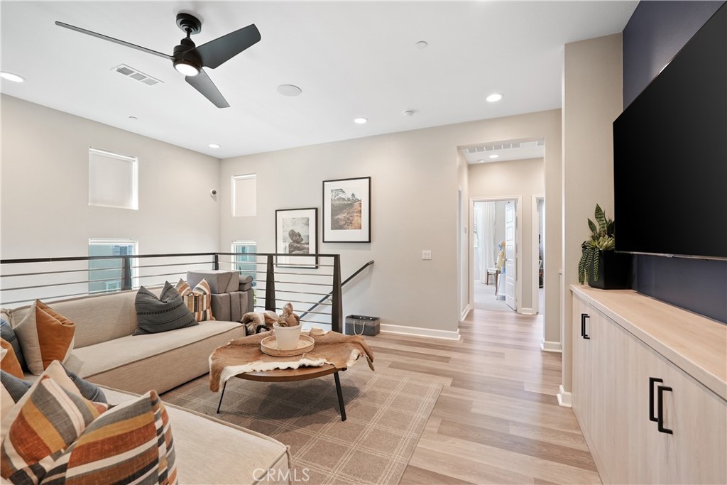 32522 Brunello Way Temecula, CA 92591 - Photo 35 of 75 a living room with furniture and a flat screen tv
