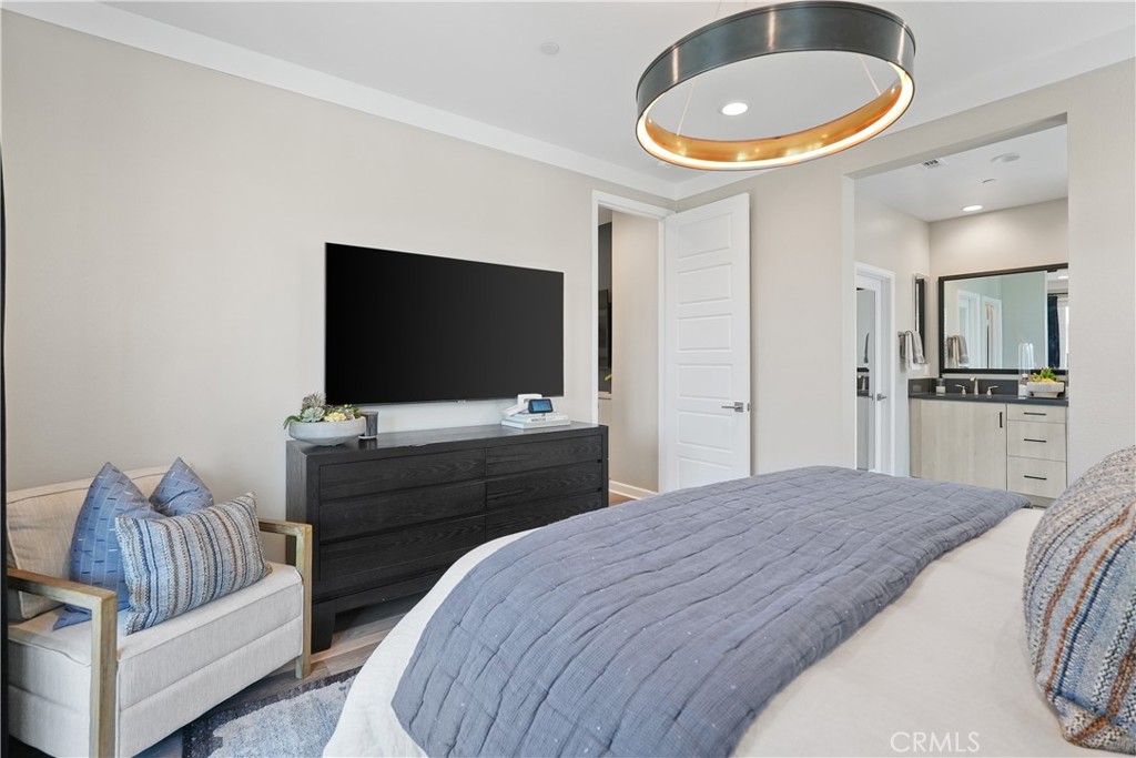 32522 Brunello Way Temecula, CA 92591 - Photo 40 of 75 a bedroom with a bed and a flat screen tv