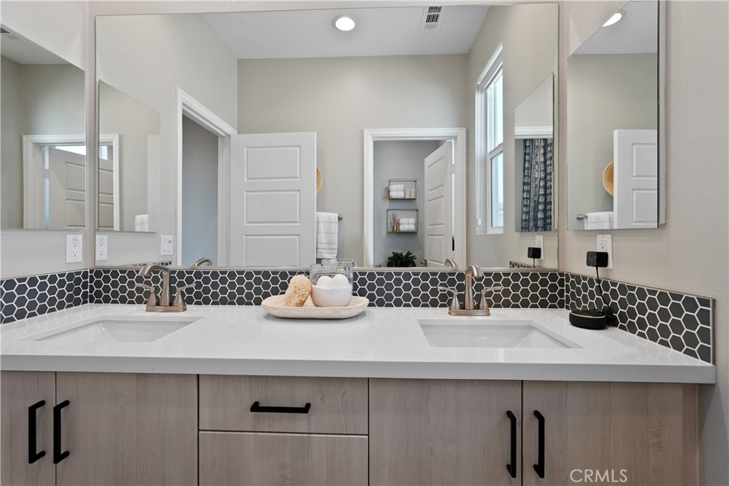 32522 Brunello Way Temecula, CA 92591 - Photo 51 of 75 a bathroom with a sink and a mirror