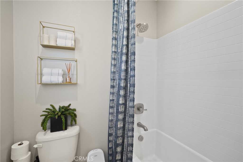 32522 Brunello Way Temecula, CA 92591 - Photo 52 of 75 a white toilet sitting next to a shower