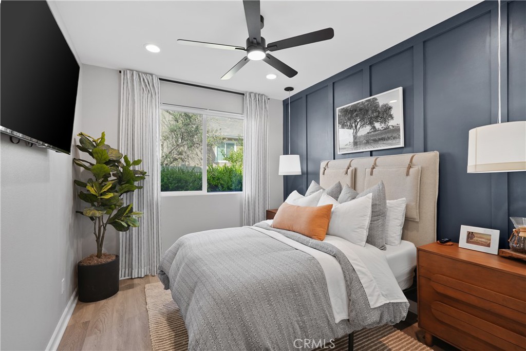 32522 Brunello Way Temecula, CA 92591 - Photo 53 of 75 a bedroom with bed and a potted plant