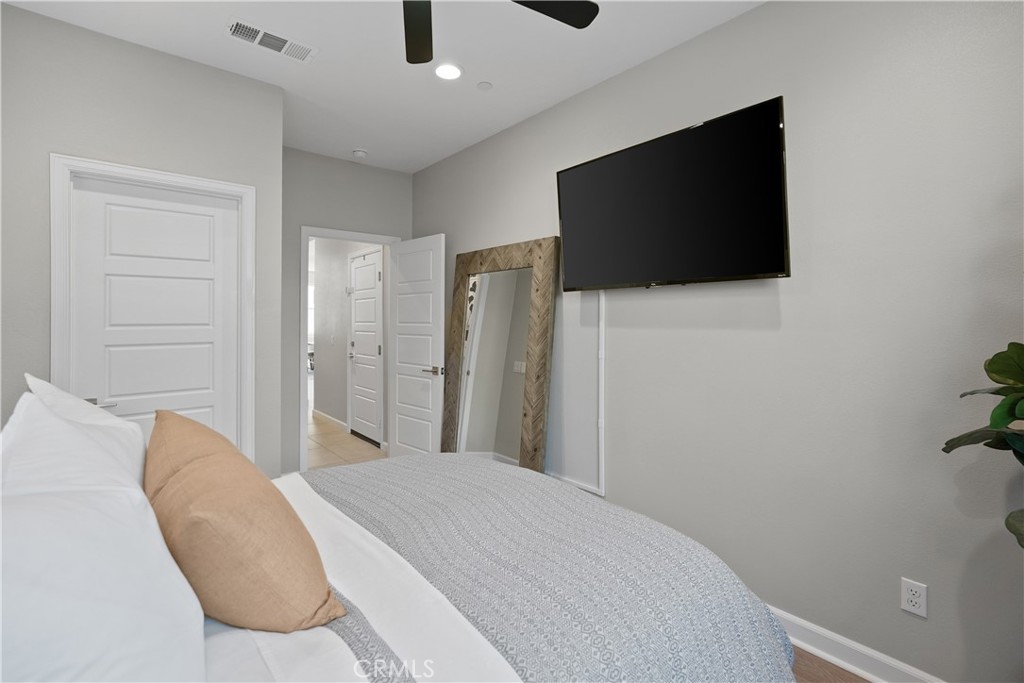 32522 Brunello Way Temecula, CA 92591 - Photo 55 of 75 a bedroom with a bed and a flat screen tv