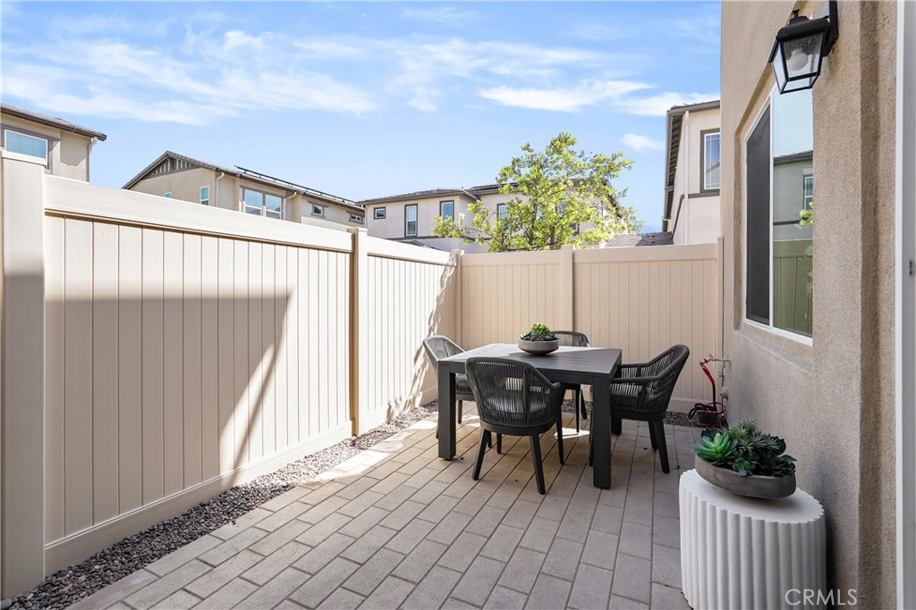 32522 Brunello Way Temecula, CA 92591 - Photo 61 of 75 a backyard of a house with table and chairs