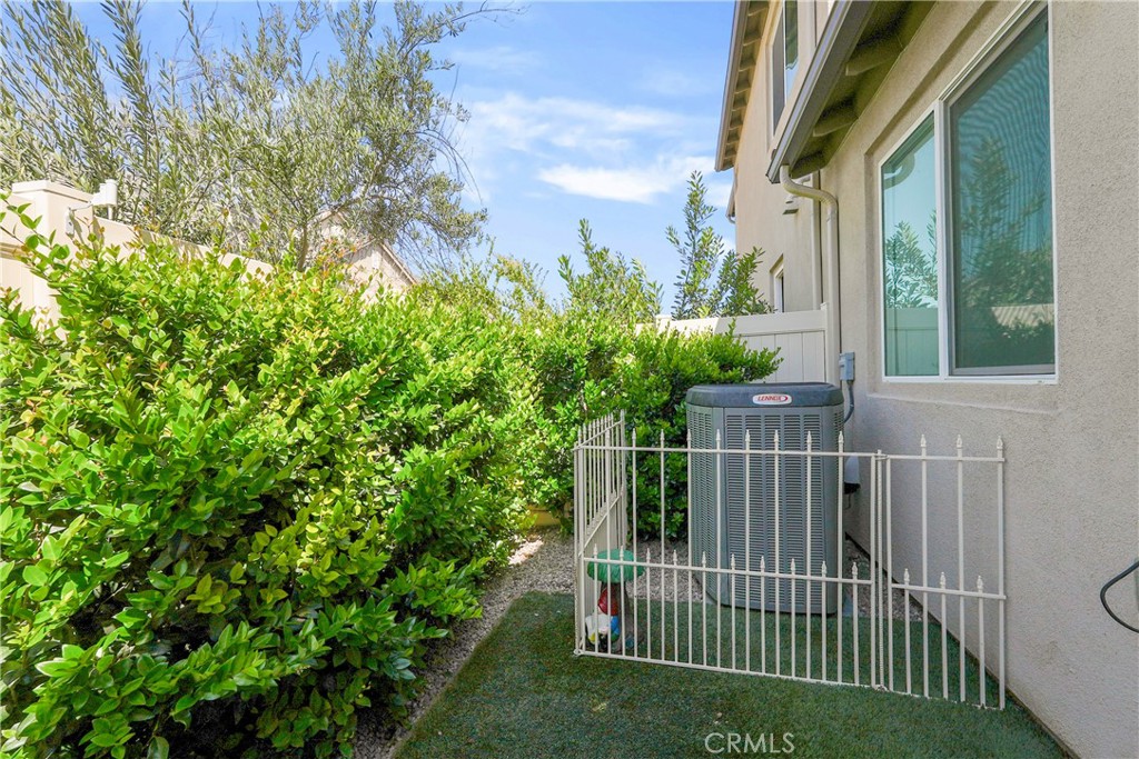 32522 Brunello Way Temecula, CA 92591 - Photo 62 of 75 a view of a house with a small yard and plants