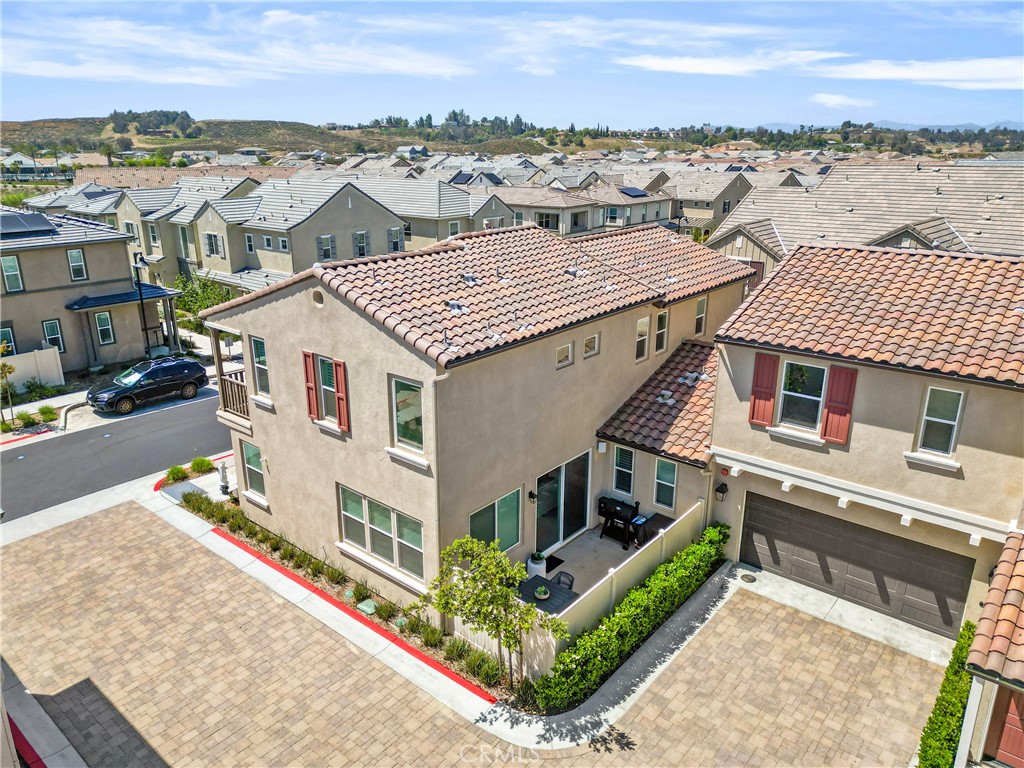 32522 Brunello Way Temecula, CA 92591 - Photo 8 of 75 an aerial view of residential houses with outdoor space and ocean view
