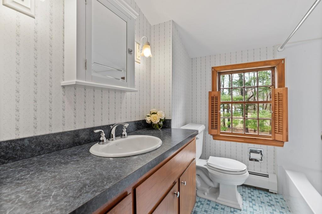 2 Craig Lane Hingham, MA 02043 - Photo 14 of 18 a bathroom with a granite countertop sink toilet and mirror