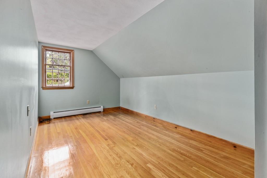 2 Craig Lane Hingham, MA 02043 - Photo 15 of 18 a view of an empty room with wooden floor and a window