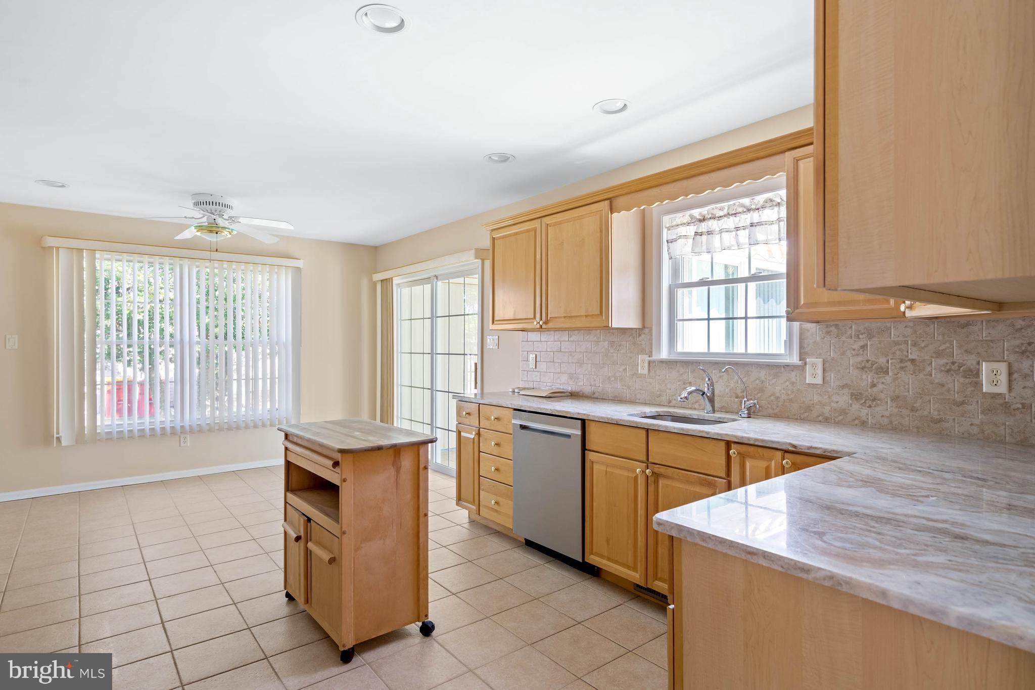 4 Alderleaf Drive Lewes, DE 19958 - Photo 11 of 43 a kitchen with a sink stove and cabinets