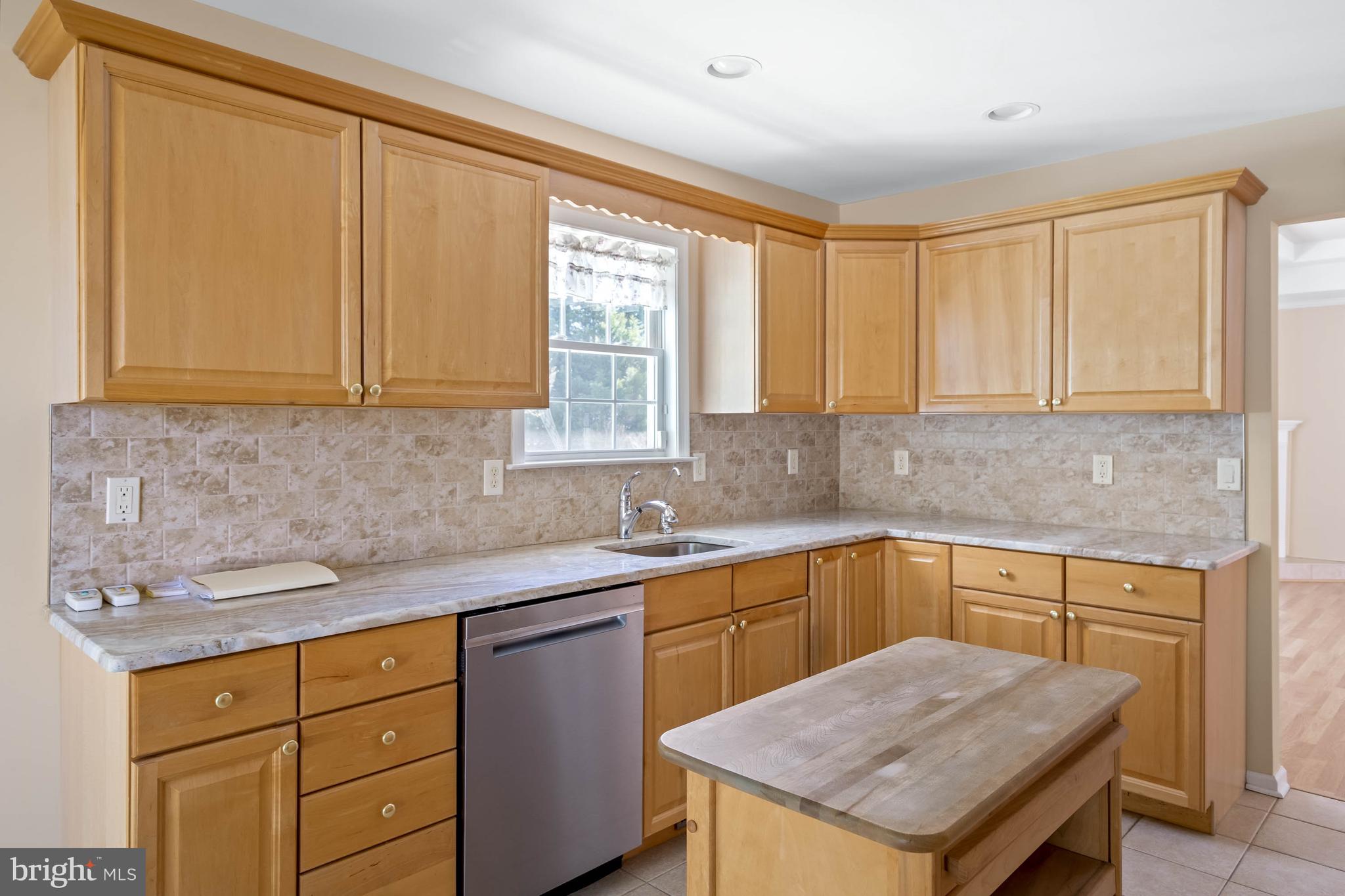 4 Alderleaf Drive Lewes, DE 19958 - Photo 13 of 43 a kitchen with a sink stove and cabinets