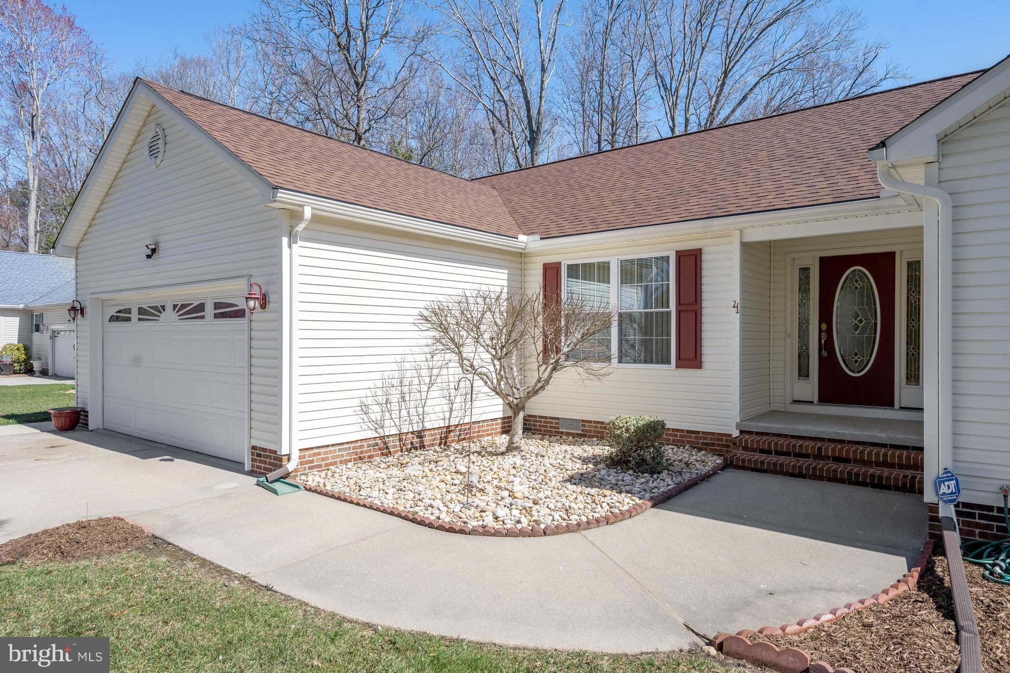 4 Alderleaf Drive Lewes, DE 19958 - Photo 2 of 43 a front view of a house with garden
