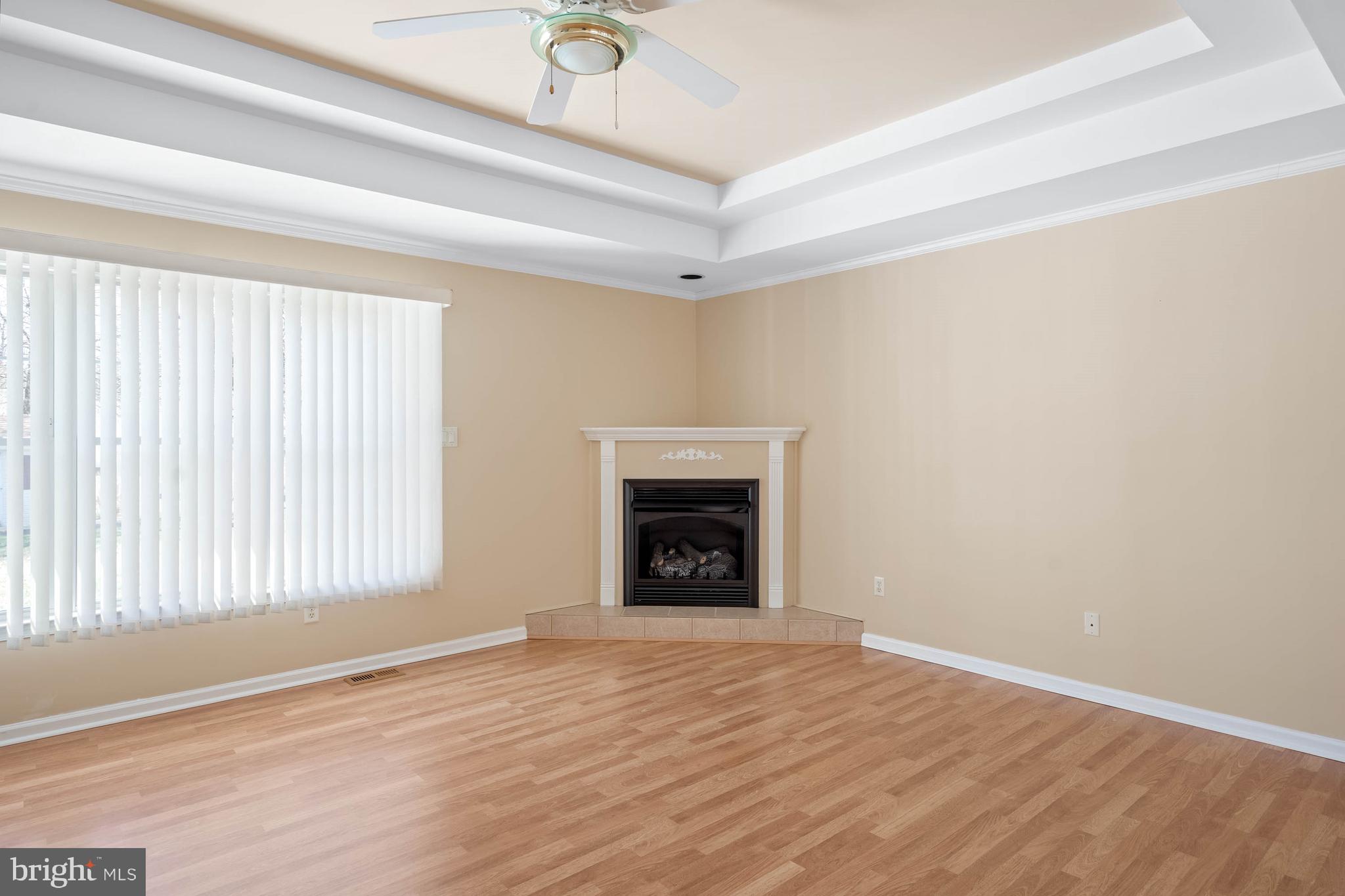 4 Alderleaf Drive Lewes, DE 19958 - Photo 8 of 43 a view of an empty room with a window and fireplace