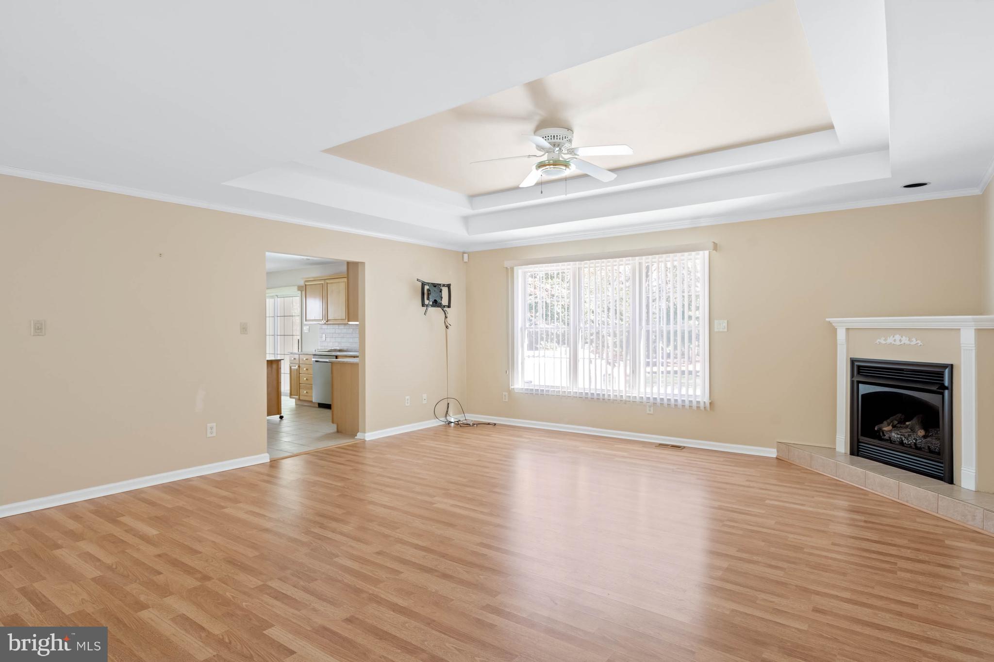 4 Alderleaf Drive Lewes, DE 19958 - Photo 9 of 43 a view of an empty room with wooden floor fireplace and a window